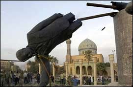 [ Statue of Saddam Hussein being toppled ]